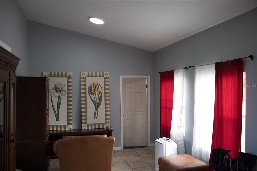 6130 Fussell Road Polk City, FL 33868 - Photo 7 of 21 a living room with furniture and a window