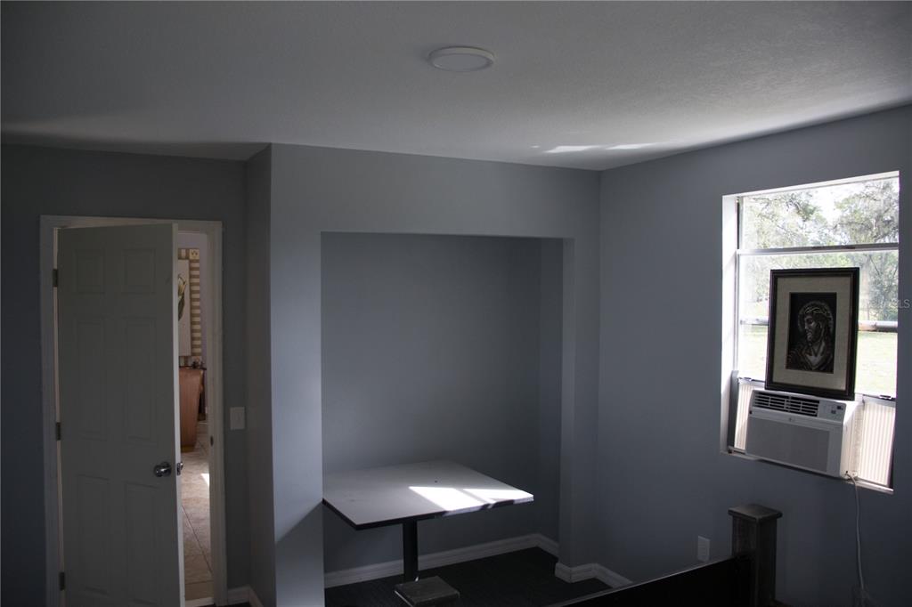 6130 Fussell Road Polk City, FL 33868 - Photo 8 of 21 a view of a hallway with workspace