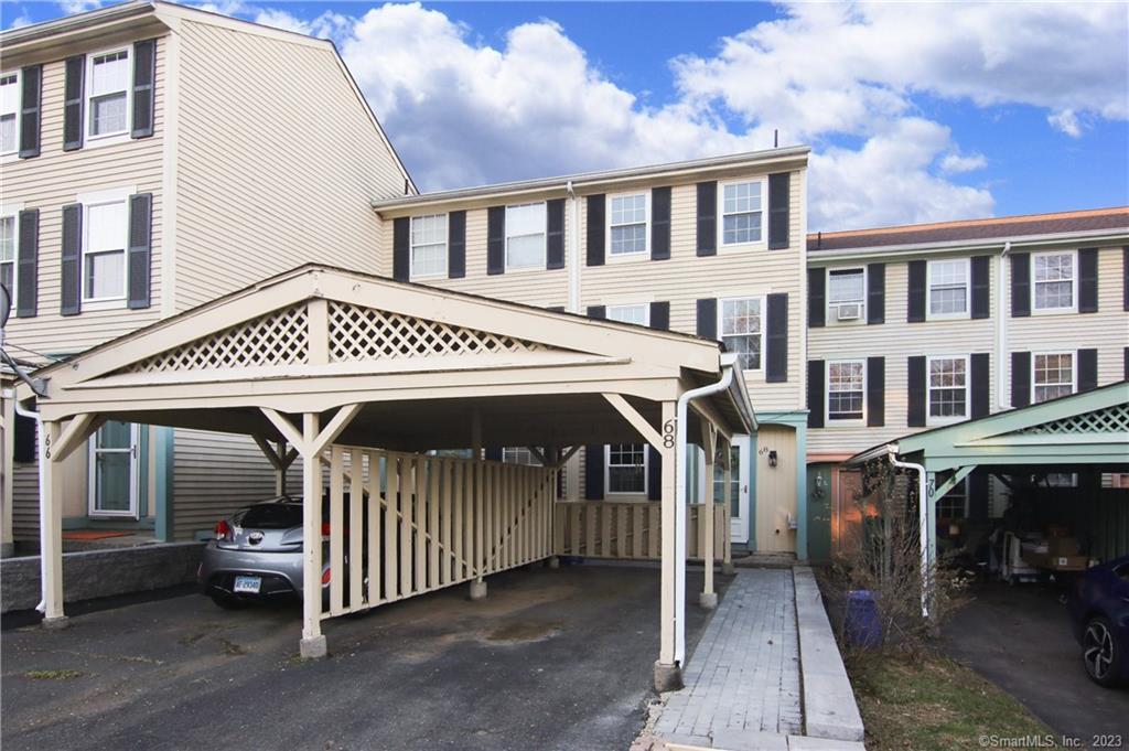 68 Rising Trail Drive, Unit 68 Middletown, CT 06457 - Photo 1 of 1 a view of a house with a porch