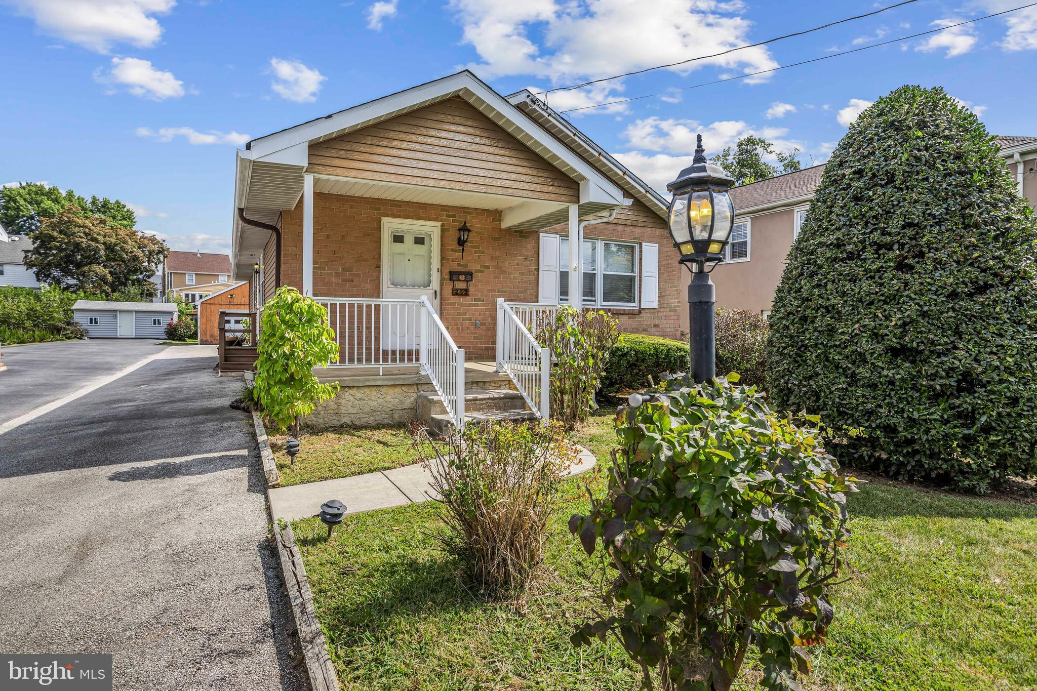 253 Saxer Avenue Springfield, PA 19064 - Photo 1 of 25 a front view of a house with garden