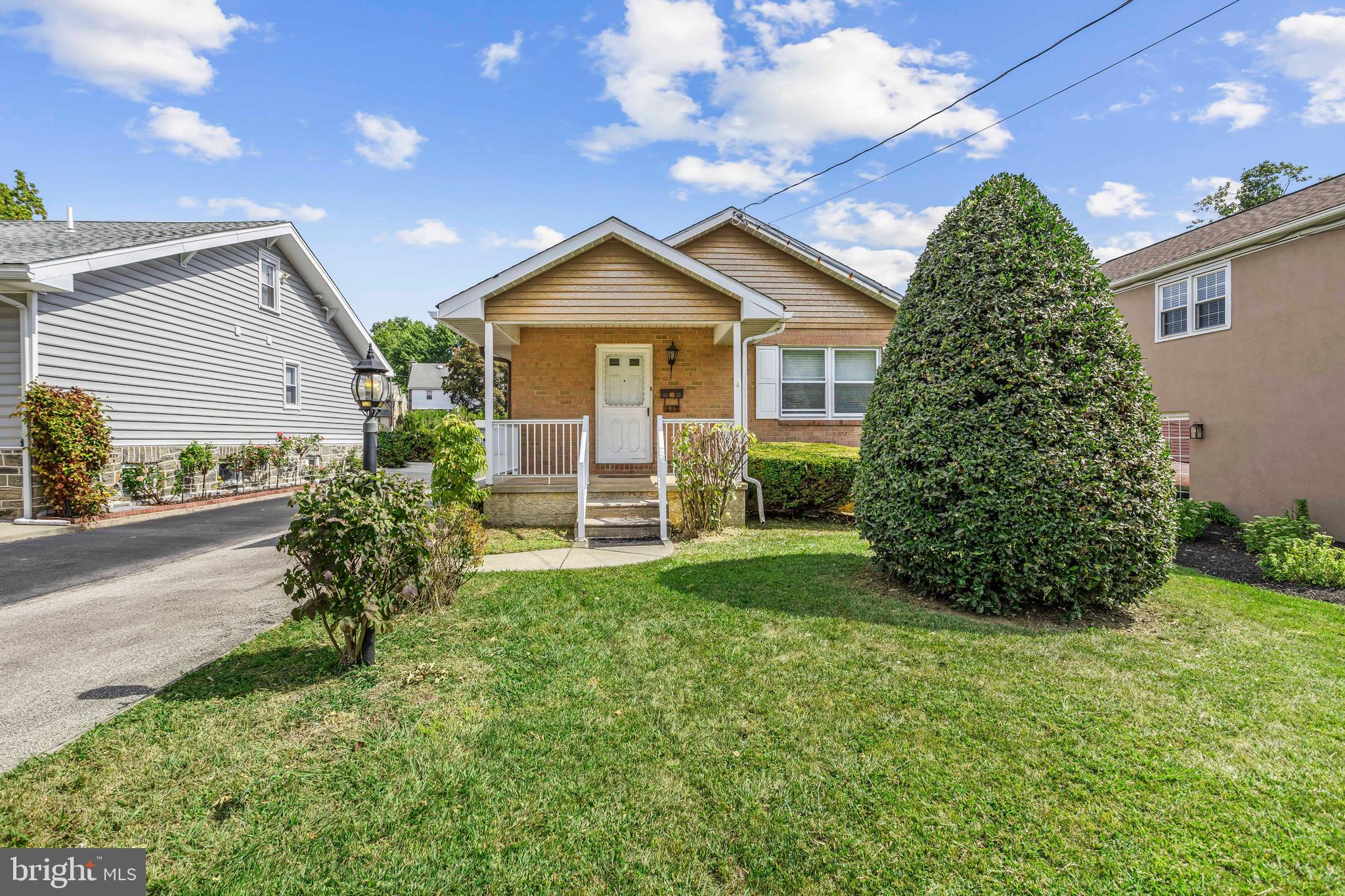 253 Saxer Avenue Springfield, PA 19064 - Photo 2 of 25 a front view of a house with garden
