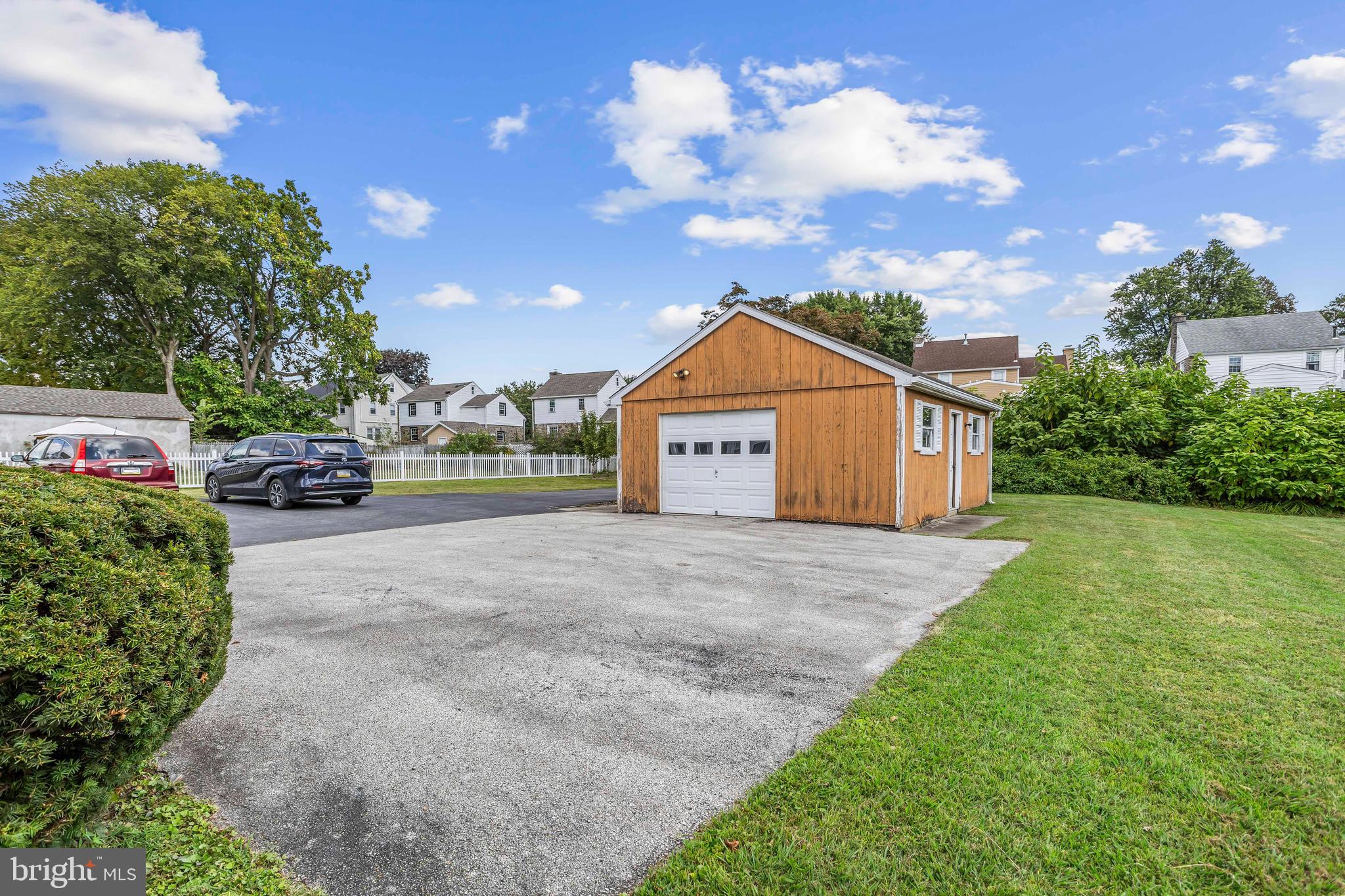 253 Saxer Avenue Springfield, PA 19064 - Photo 22 of 25 a front view of a house with a yard and garage
