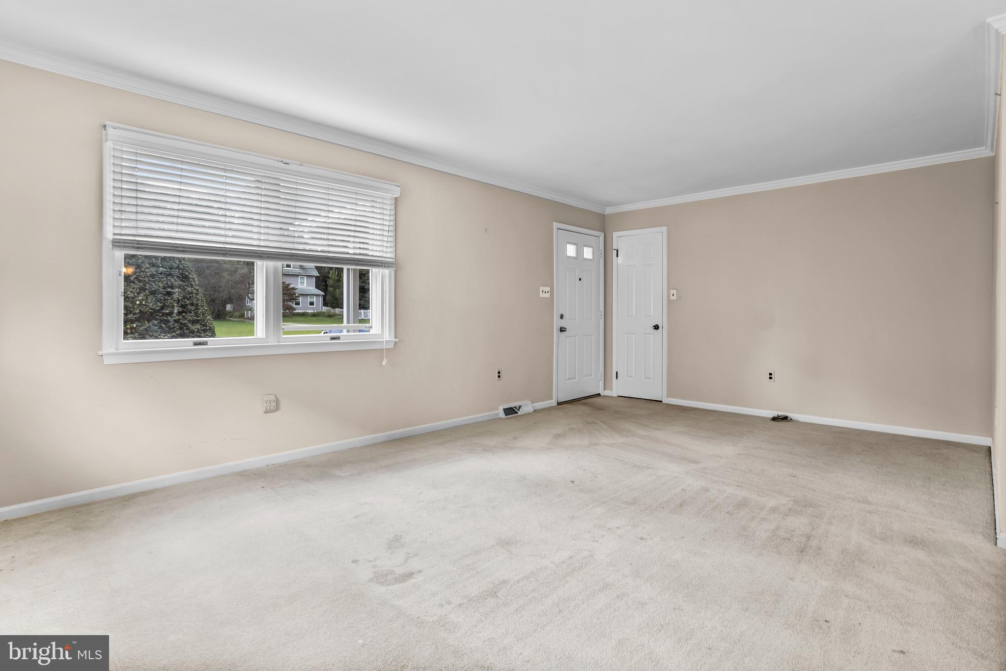 253 Saxer Avenue Springfield, PA 19064 - Photo 4 of 25 a view of an empty room with a window