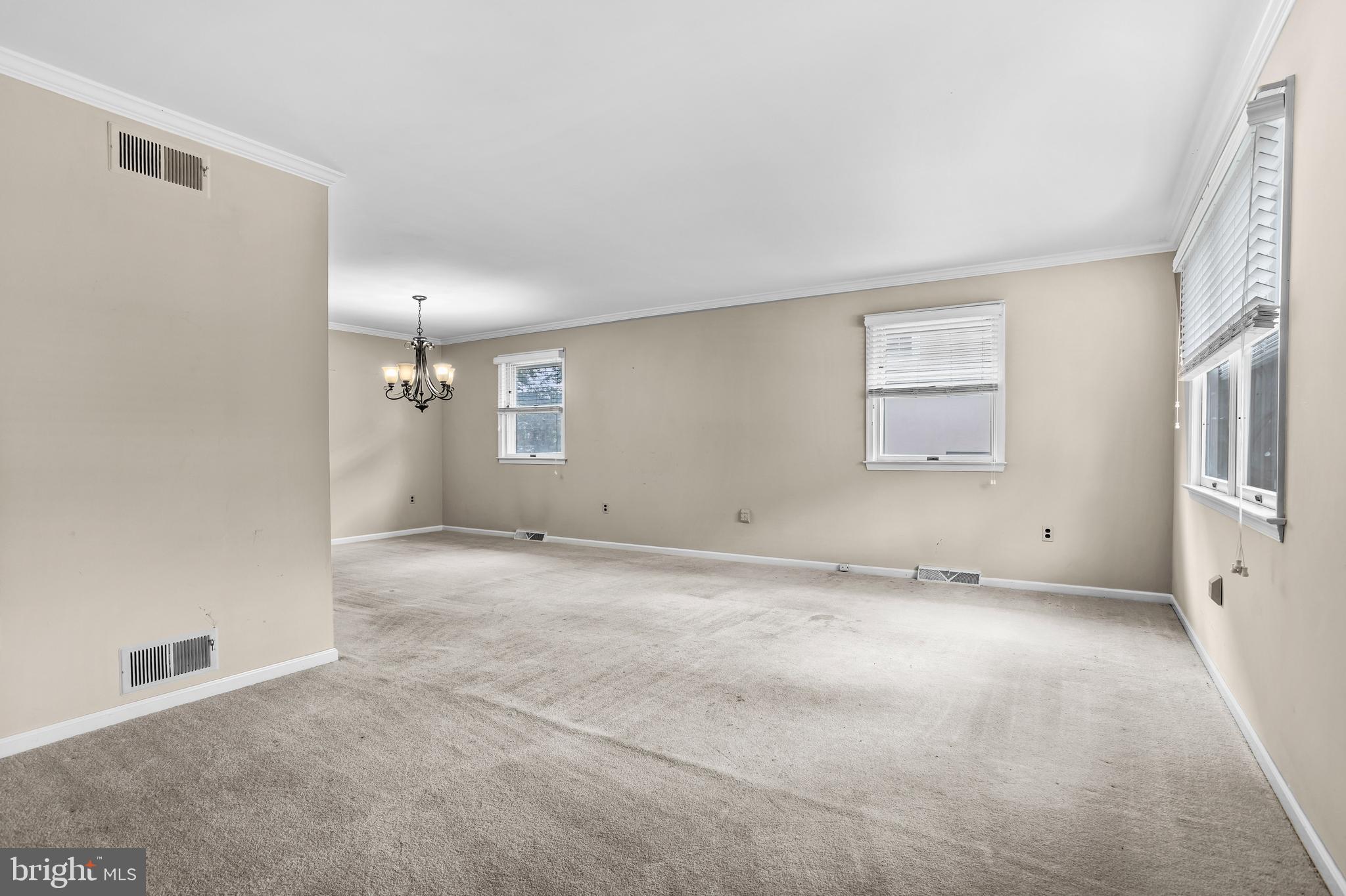 253 Saxer Avenue Springfield, PA 19064 - Photo 6 of 25 an empty room with a empty space and windows