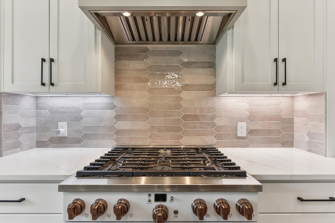 116 Tranquility Trail Spicewood, TX 78669 - Photo 17 of 40 a stove top oven sitting inside of a kitchen