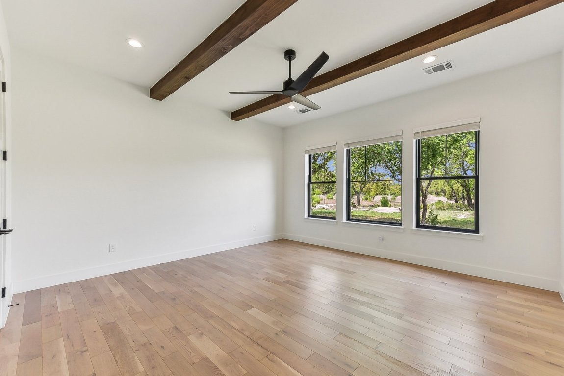 116 Tranquility Trail Spicewood, TX 78669 - Photo 30 of 40 a view of an empty room with a window