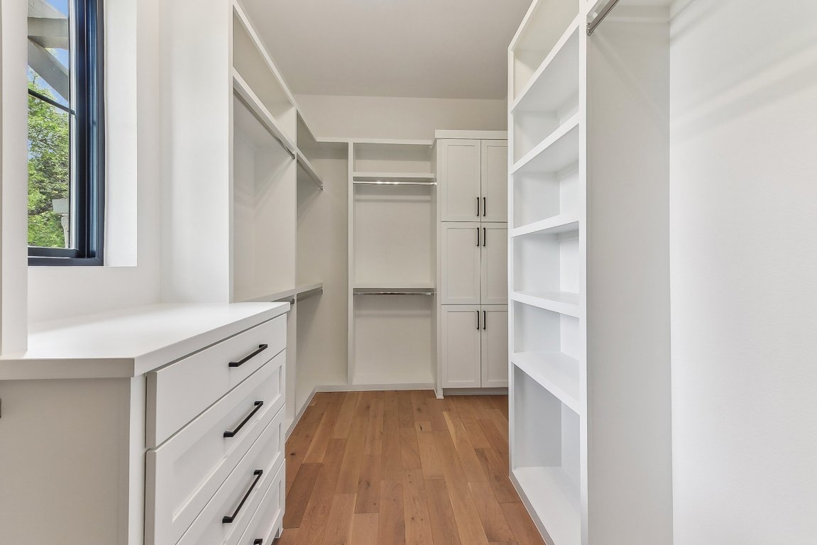 116 Tranquility Trail Spicewood, TX 78669 - Photo 35 of 40 a view of walk in closet with empty racks