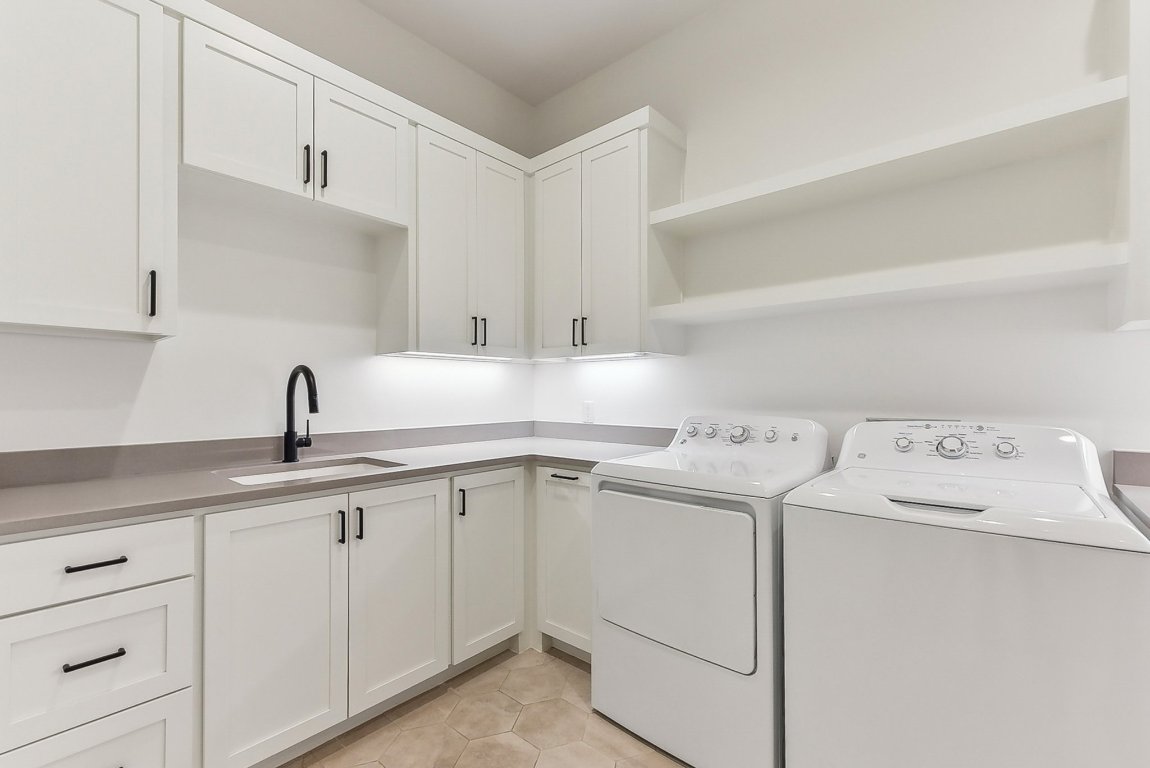 116 Tranquility Trail Spicewood, TX 78669 - Photo 36 of 40 a utility room with dryer and washer