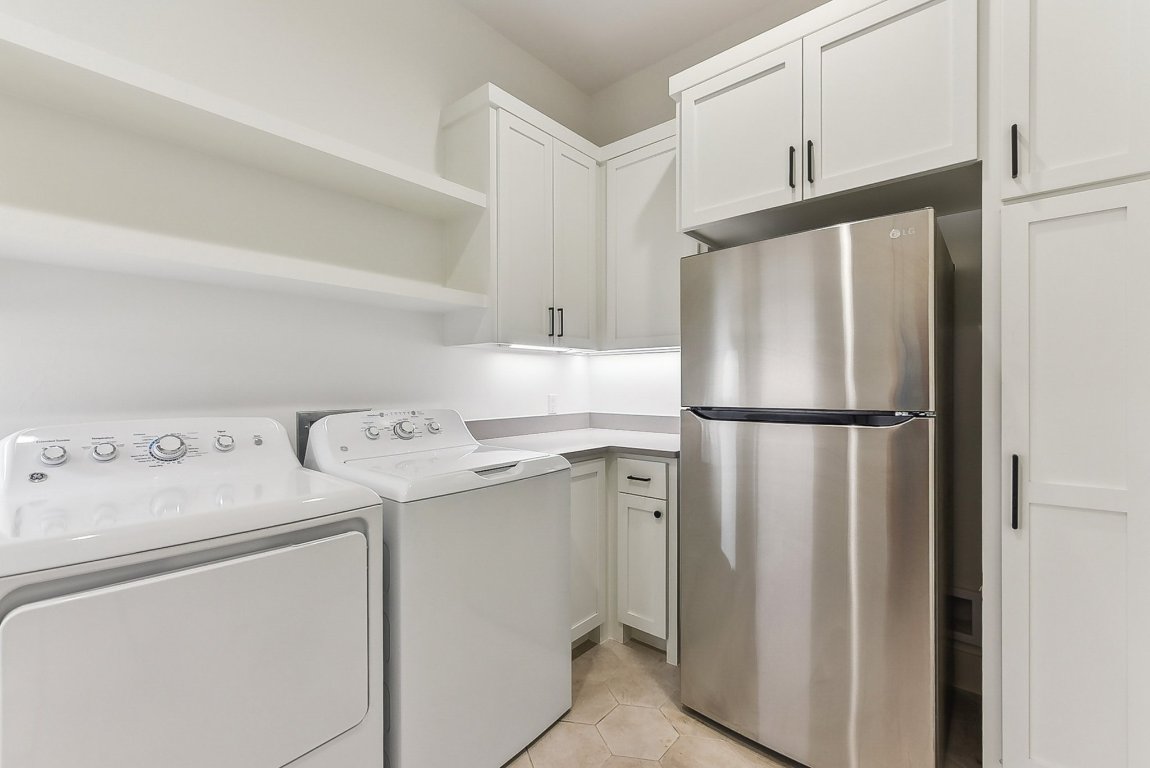 116 Tranquility Trail Spicewood, TX 78669 - Photo 37 of 40 a utility room with dryer and washer