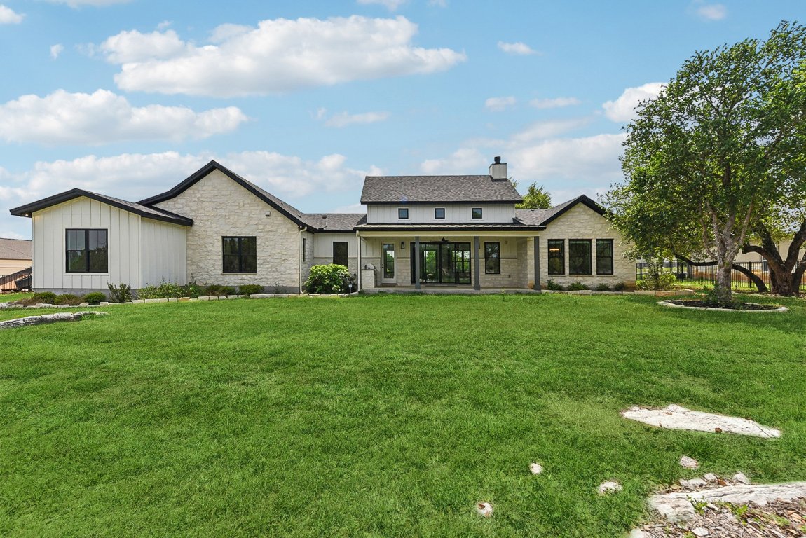 116 Tranquility Trail Spicewood, TX 78669 - Photo 4 of 40 a view of a house with a yard