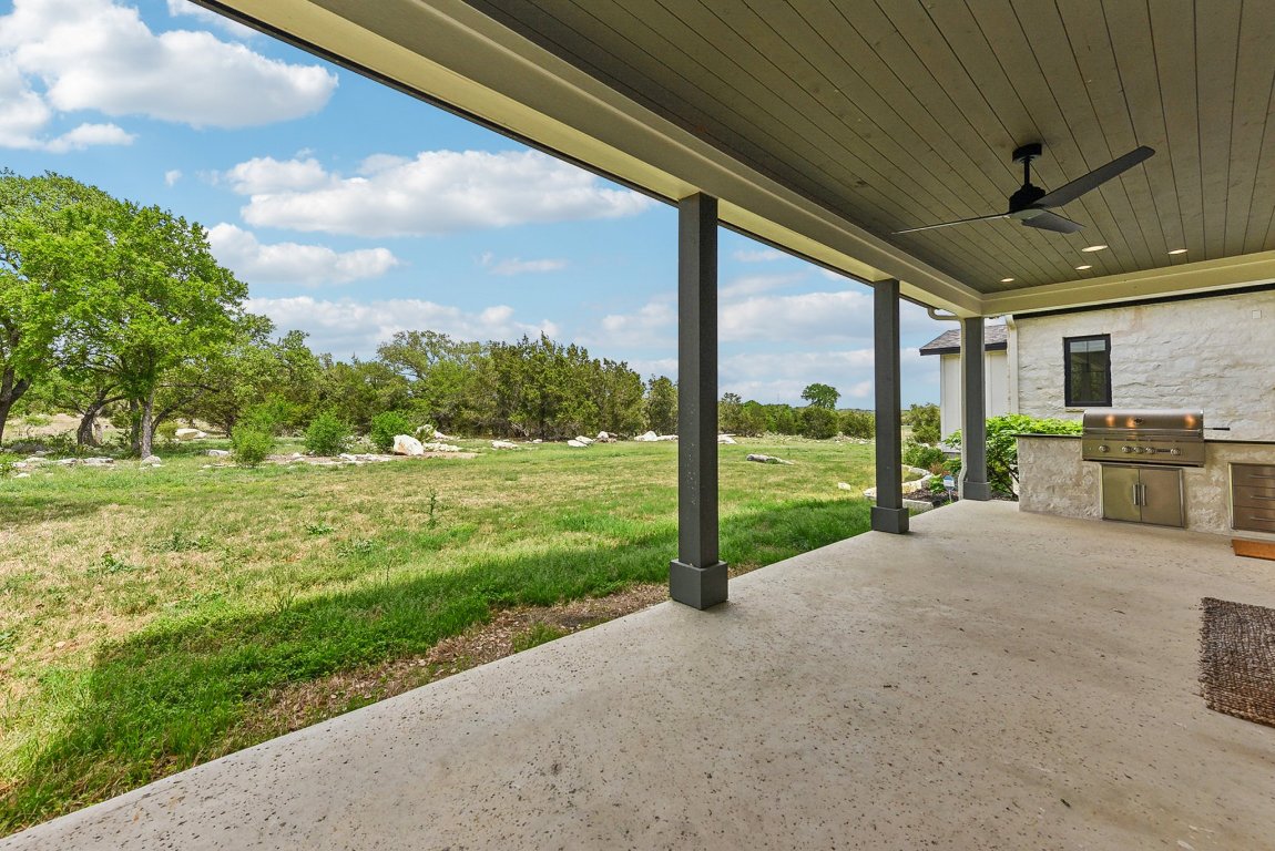 116 Tranquility Trail Spicewood, TX 78669 - Photo 5 of 40 a view of a house with backyard and porch