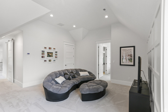 1354 South 800 East Mapleton, UT 84664 - Photo 61 of 129 Living area featuring light carpet, lofted ceiling, and recessed lighting