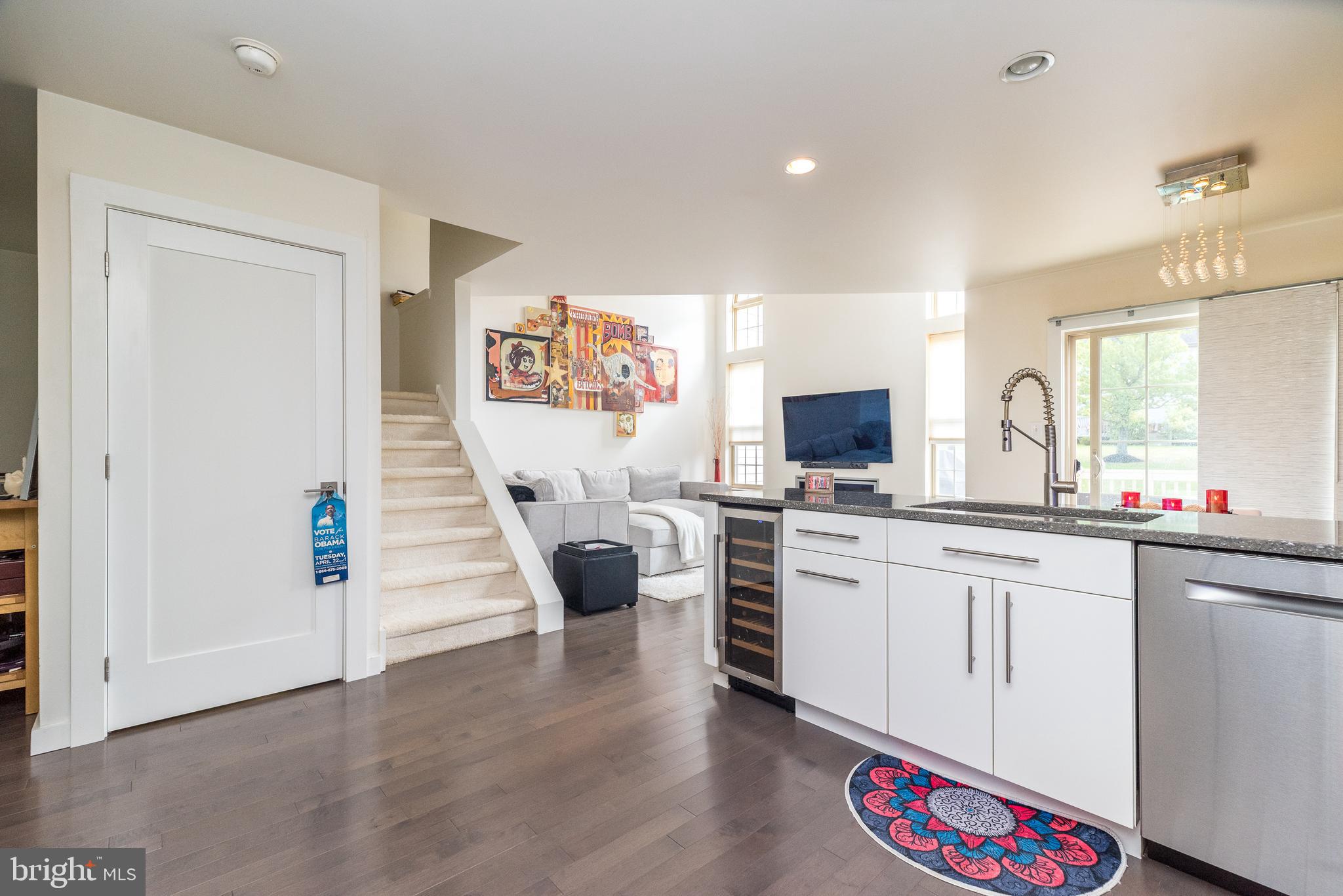 5087 Beacon Hill Court Doylestown, PA 18902 - Photo 12 of 28 a large white kitchen with a sink and dishwasher a stove with wooden floor