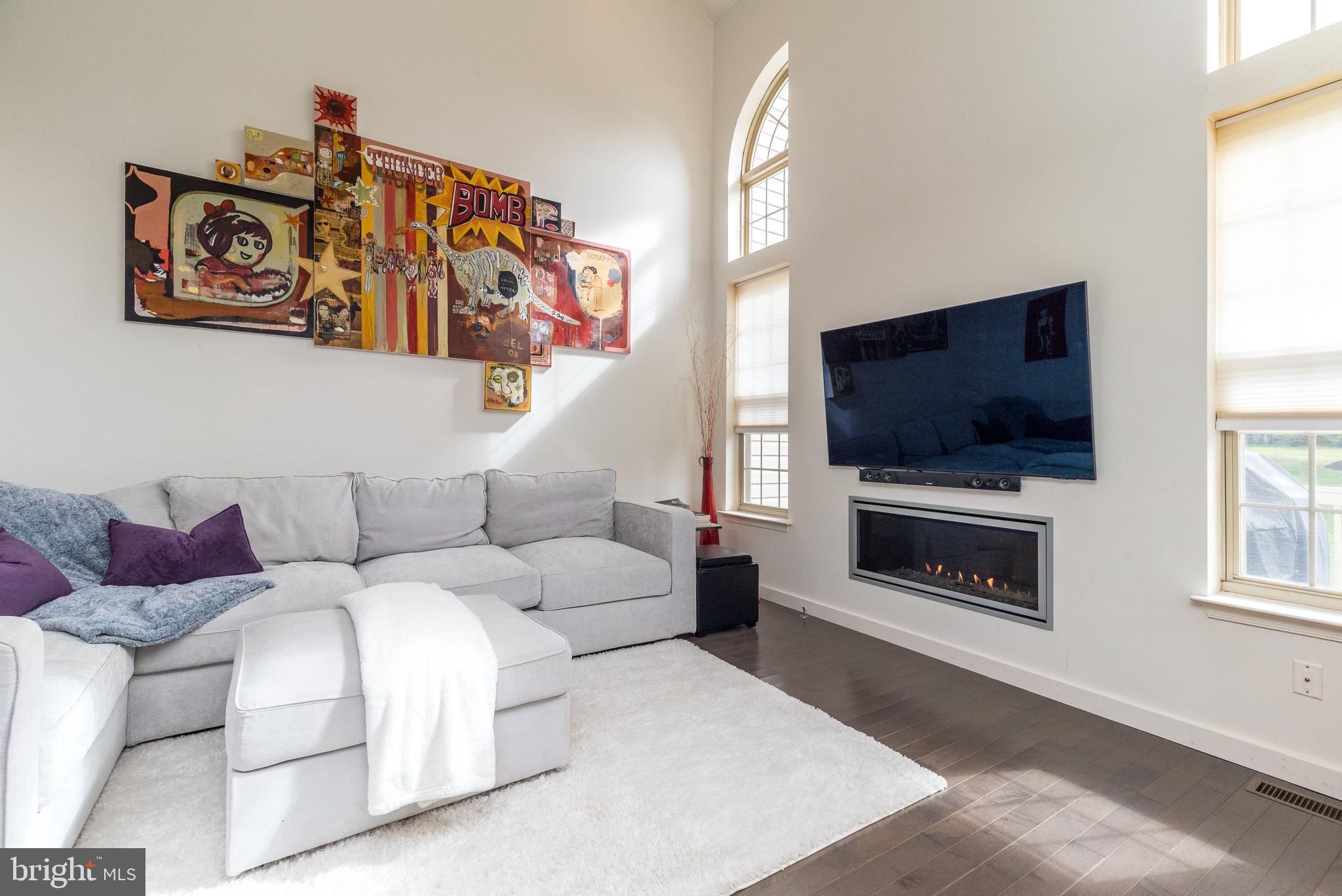 5087 Beacon Hill Court Doylestown, PA 18902 - Photo 14 of 28 a living room with furniture and a flat screen tv