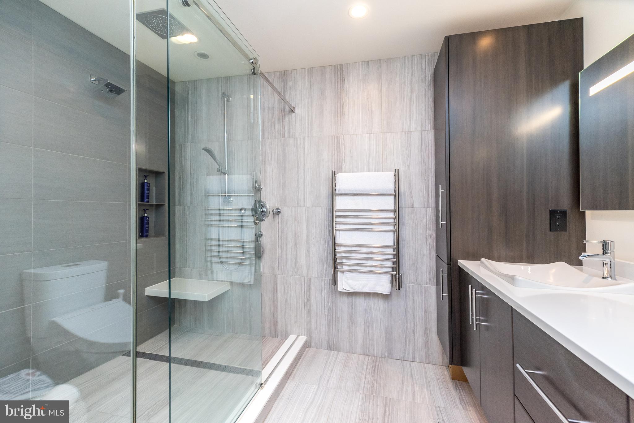 5087 Beacon Hill Court Doylestown, PA 18902 - Photo 18 of 28 a bathroom with a shower and a sink