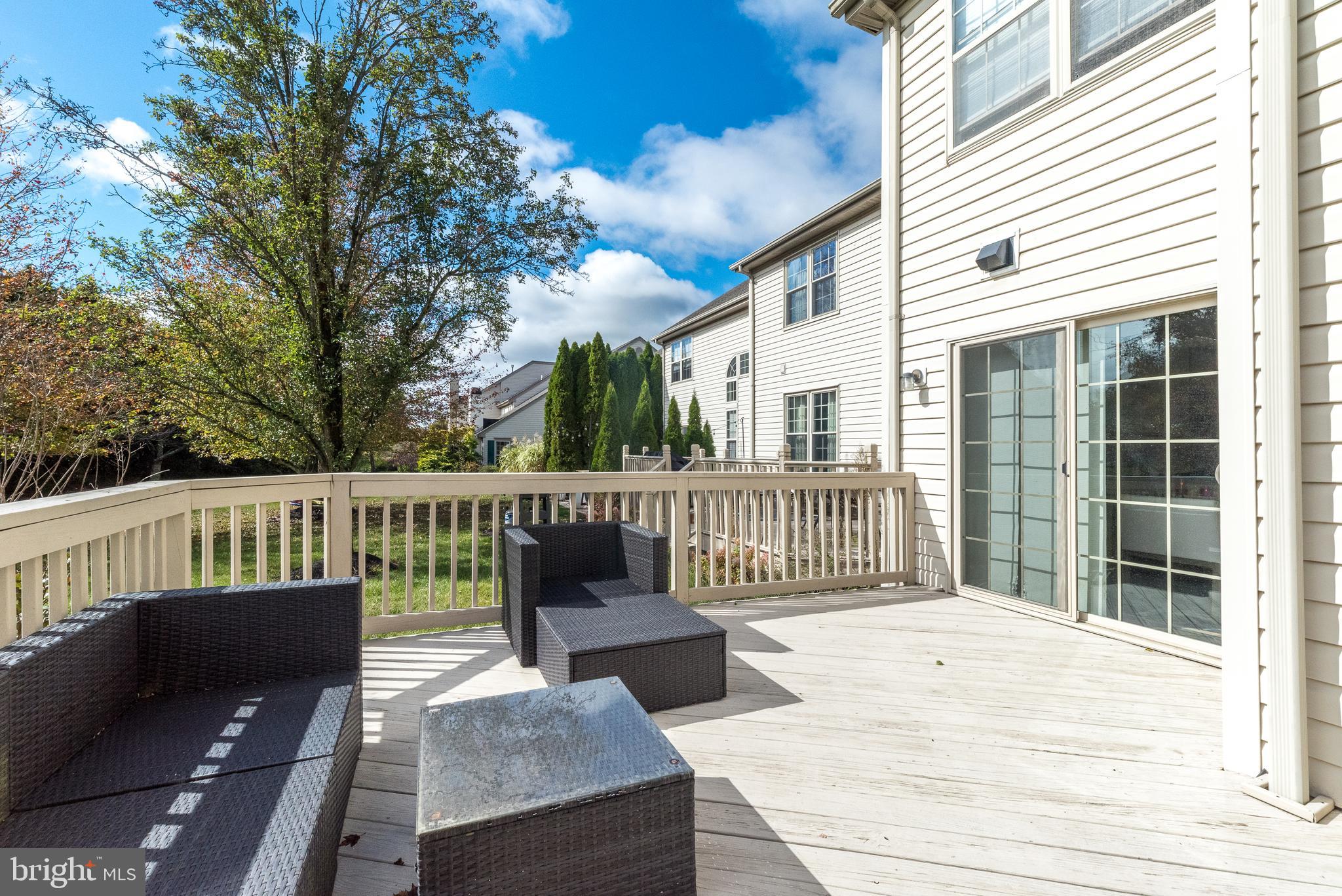 5087 Beacon Hill Court Doylestown, PA 18902 - Photo 23 of 28 a view of a wooden deck with a bench