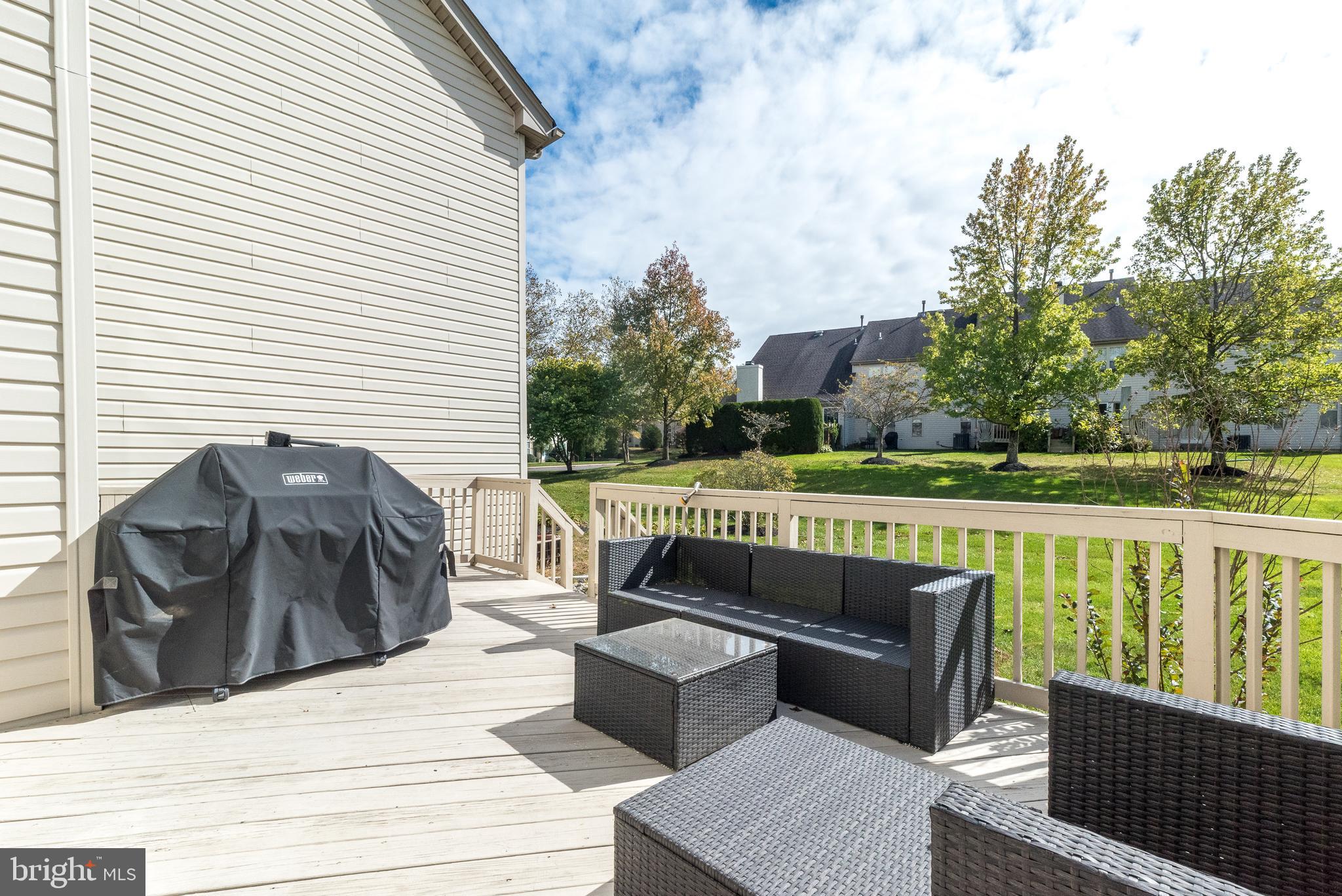 5087 Beacon Hill Court Doylestown, PA 18902 - Photo 24 of 28 a view of a roof deck with couches and wooden floor