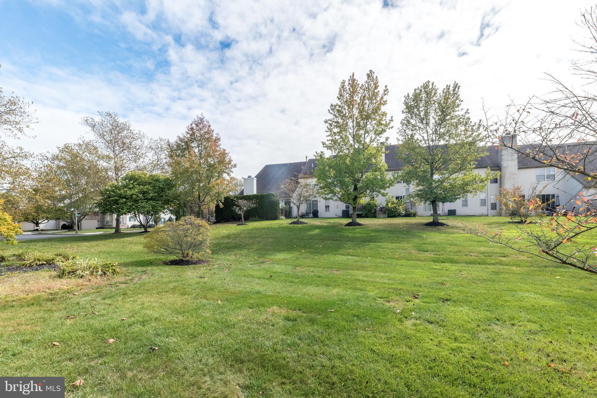 5087 Beacon Hill Court Doylestown, PA 18902 - Photo 25 of 28 a view of yard with swimming pool and trees