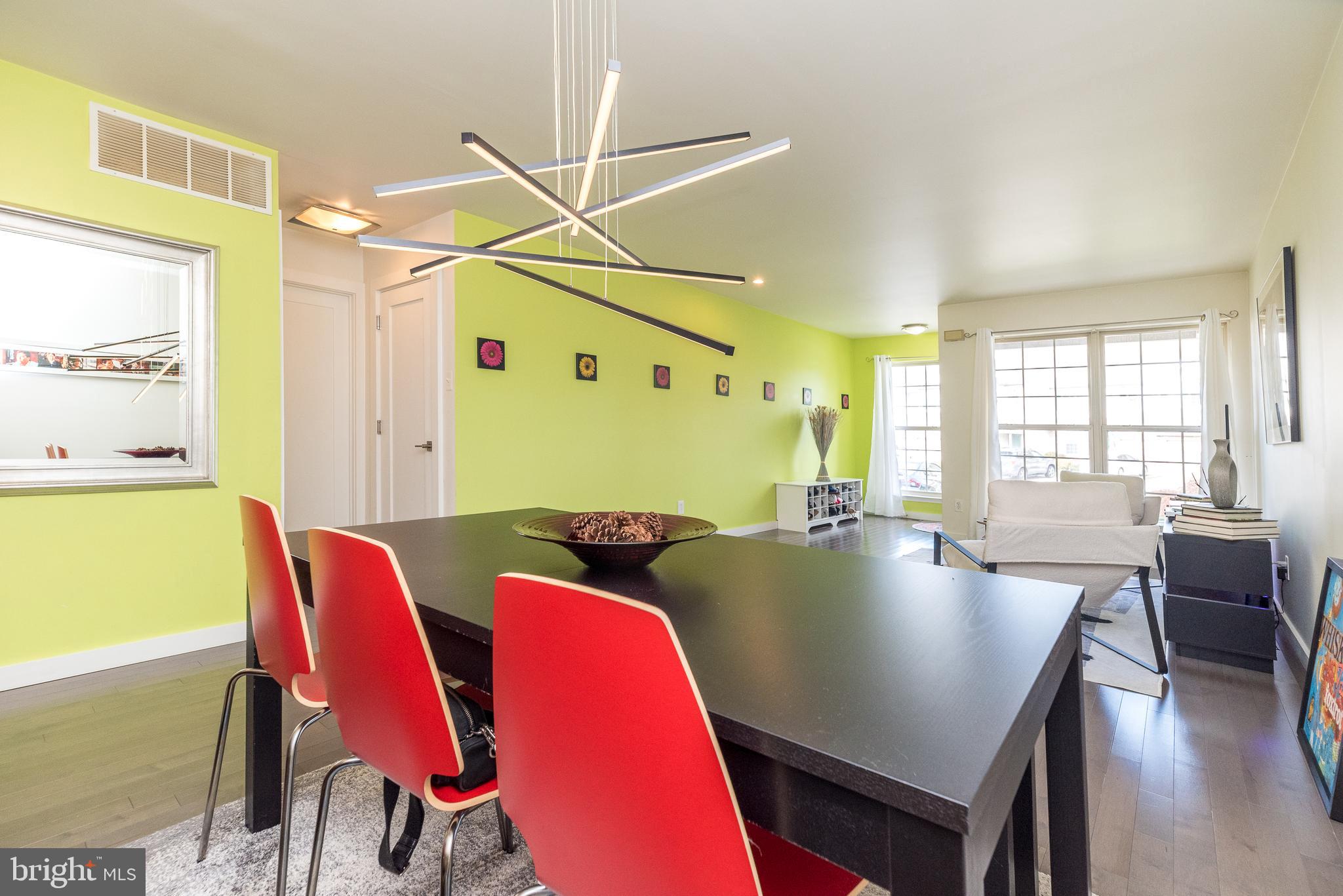 5087 Beacon Hill Court Doylestown, PA 18902 - Photo 5 of 28 a view of a dining room with furniture and wooden floor