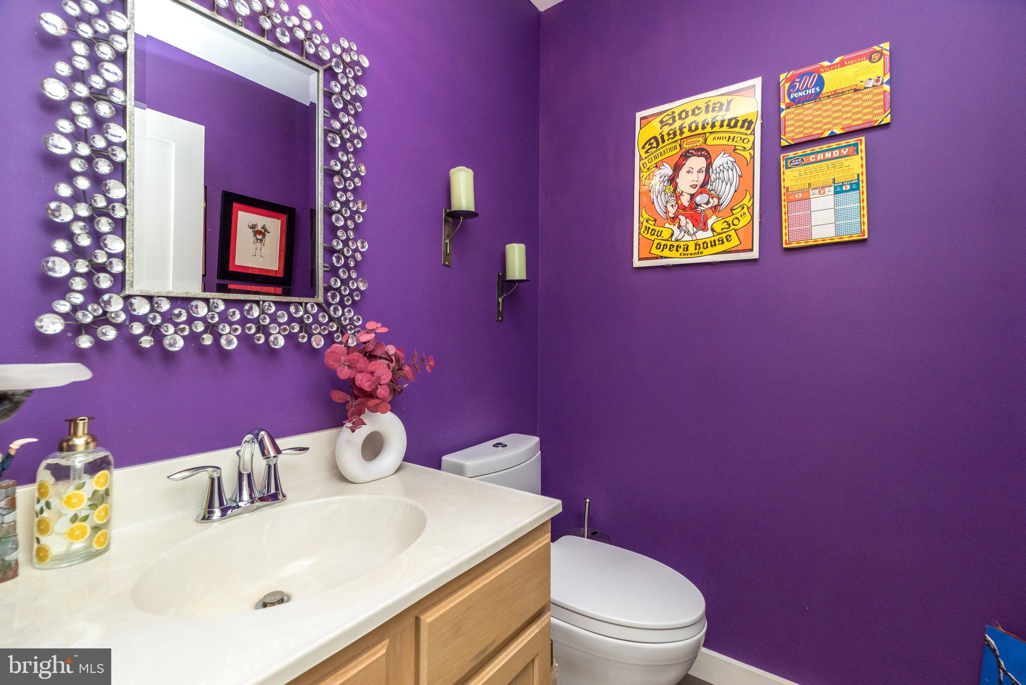 5087 Beacon Hill Court Doylestown, PA 18902 - Photo 8 of 28 a bathroom with a toilet sink and mirror