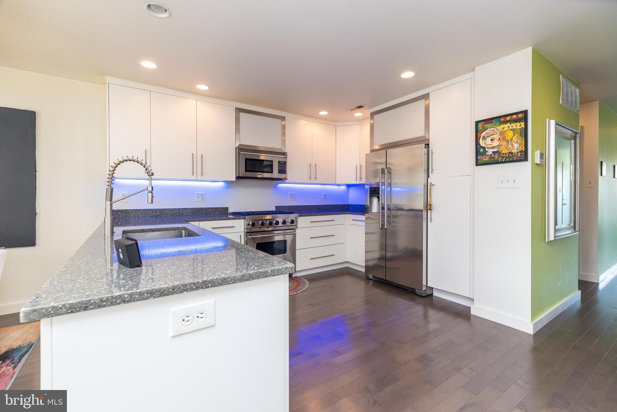 5087 Beacon Hill Court Doylestown, PA 18902 - Photo 9 of 28 a kitchen with stainless steel appliances granite countertop a refrigerator sink and stove