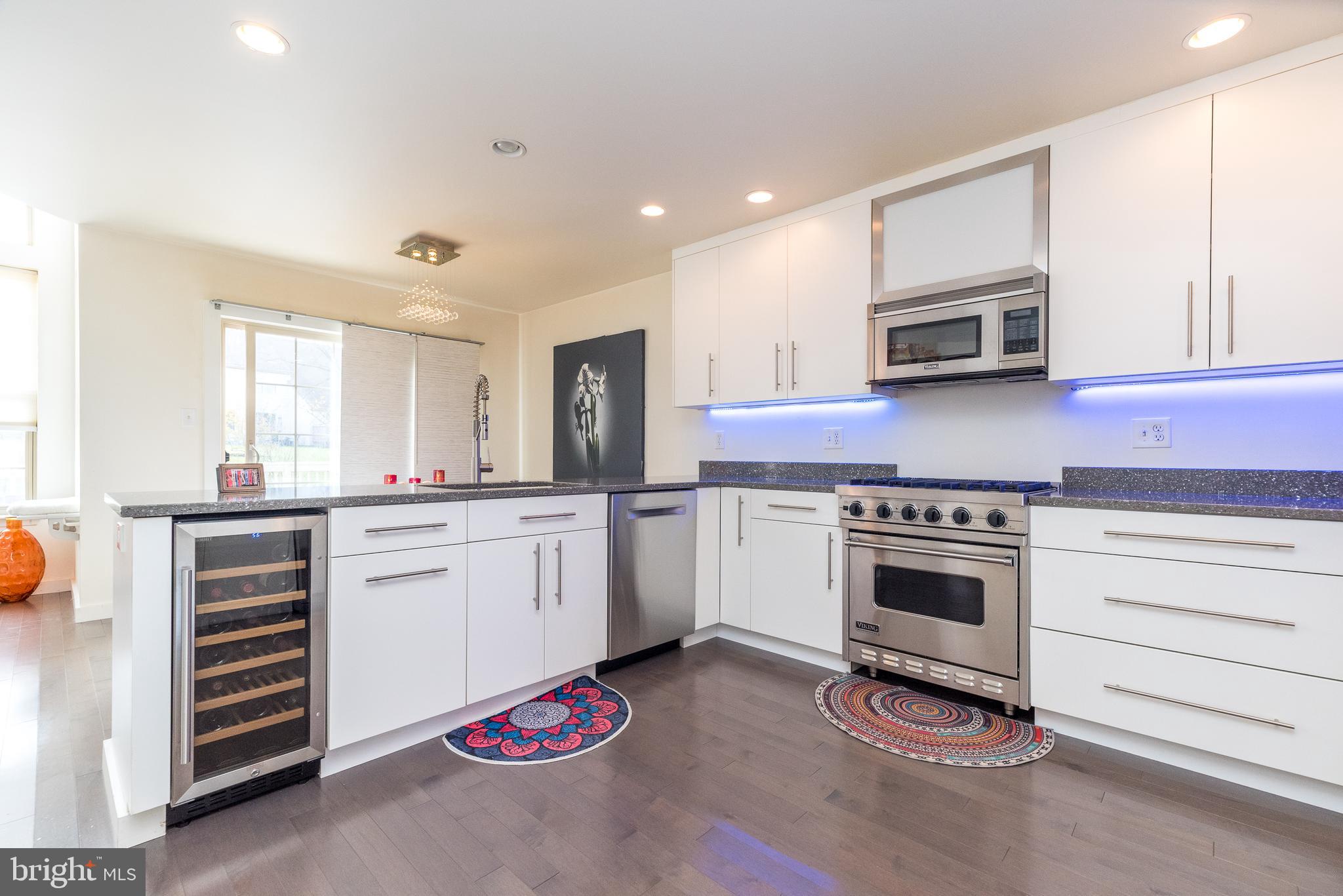 5087 Beacon Hill Court Doylestown, PA 18902 - Photo 10 of 28 a kitchen with granite countertop a stove and cabinets