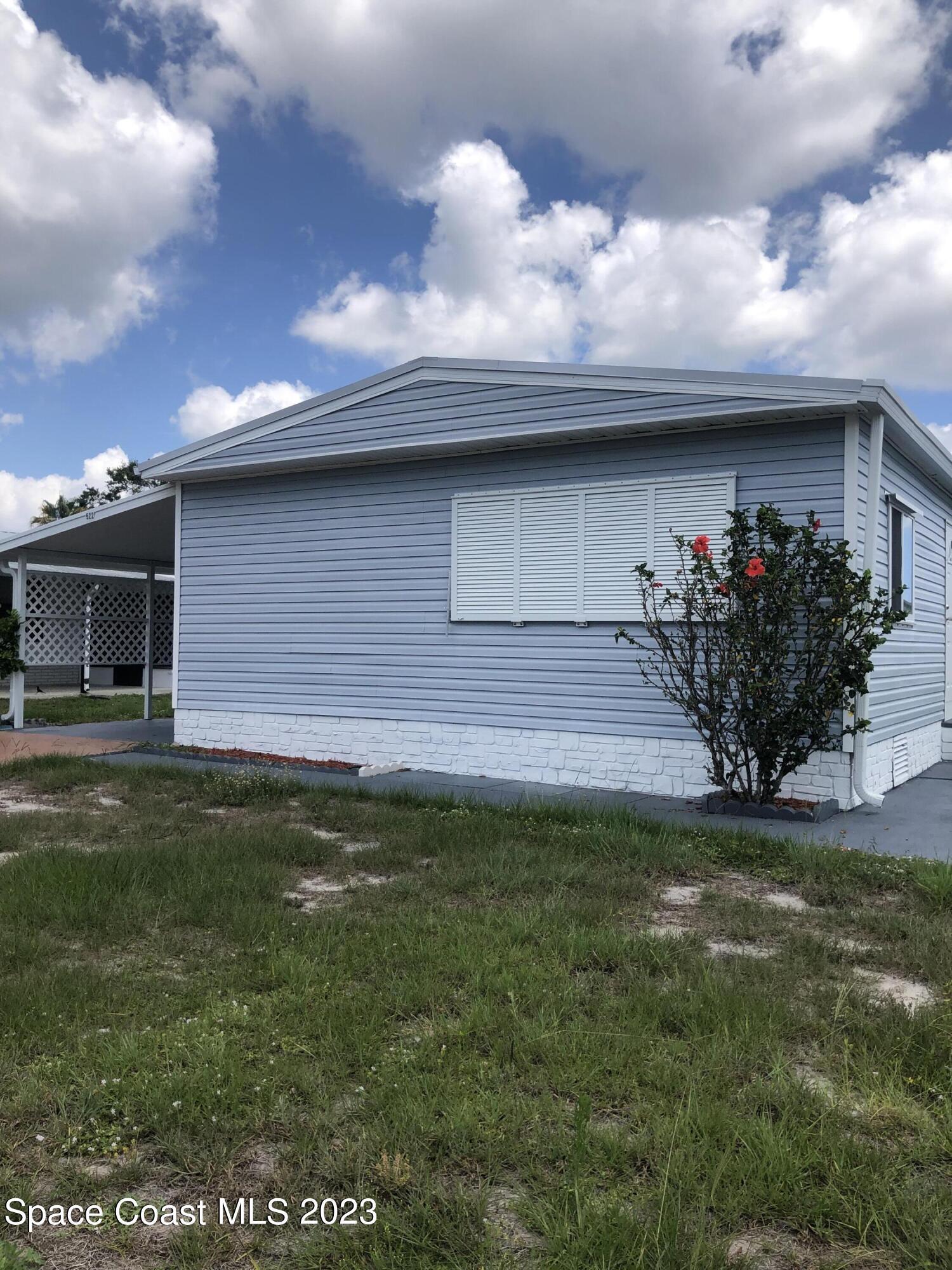 522 Egret Circle Sebastian, FL 32976 - Photo 1 of 14 a front view of a house with a garden