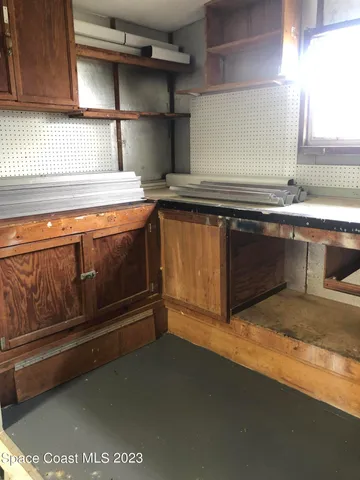 a view of storage and utility room in a kitchen