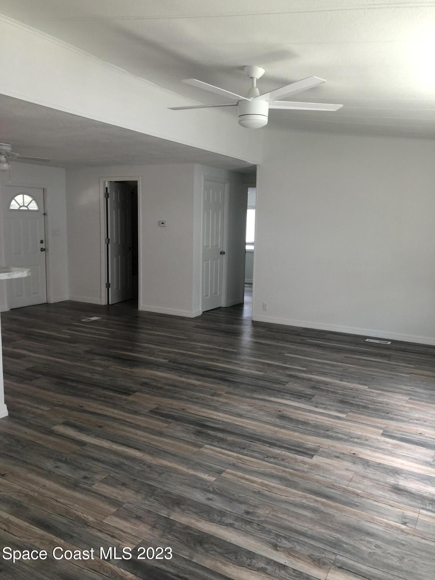 522 Egret Circle Sebastian, FL 32976 - Photo 4 of 14 wooden floor in an empty room