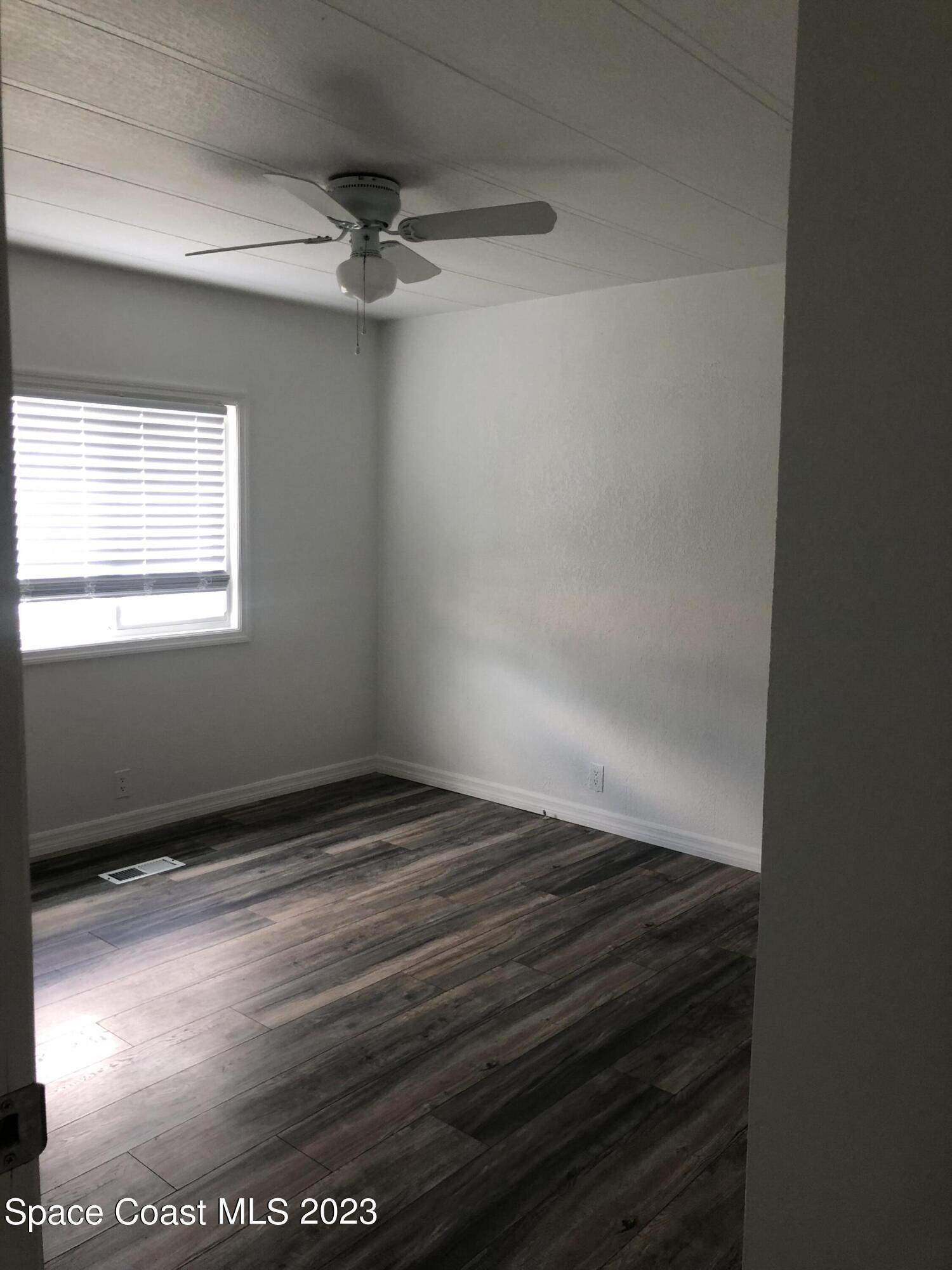 522 Egret Circle Sebastian, FL 32976 - Photo 7 of 14 a view of an empty room with a window