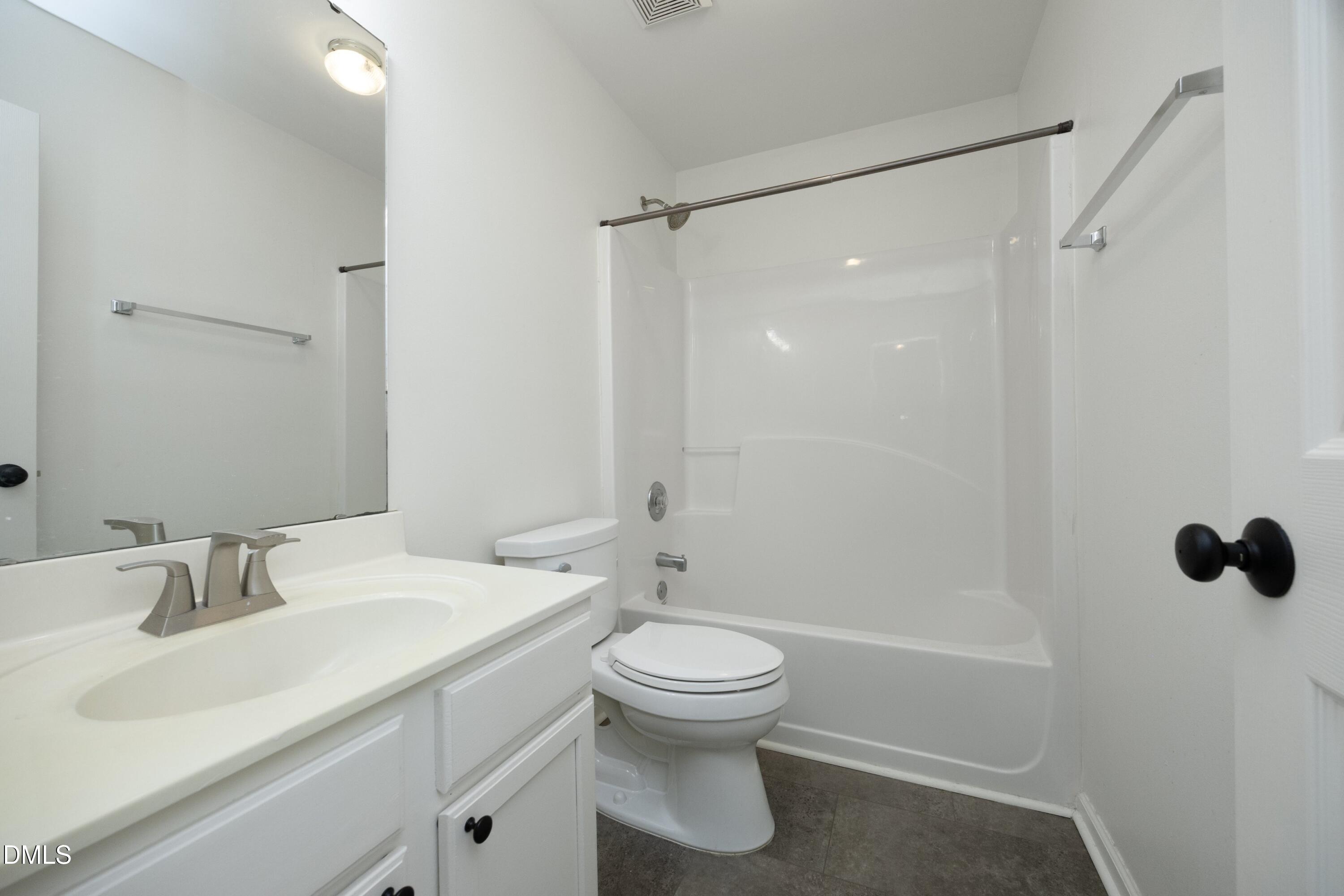 521 Renshaw Court Cary, NC 27518 - Photo 25 of 34 a bathroom with a sink toilet and shower