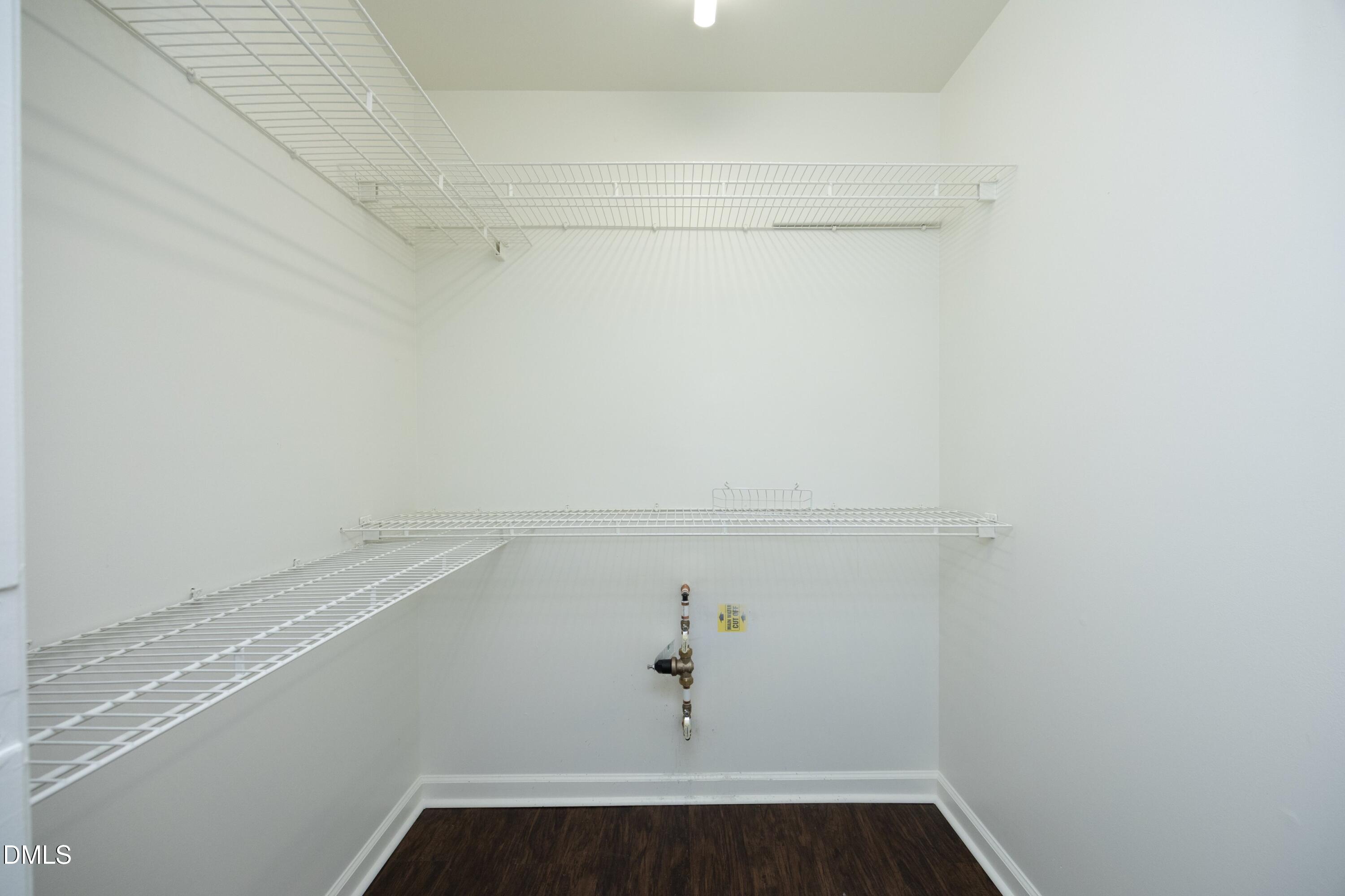 521 Renshaw Court Cary, NC 27518 - Photo 26 of 34 a view of storage and utility room with racks on the wall