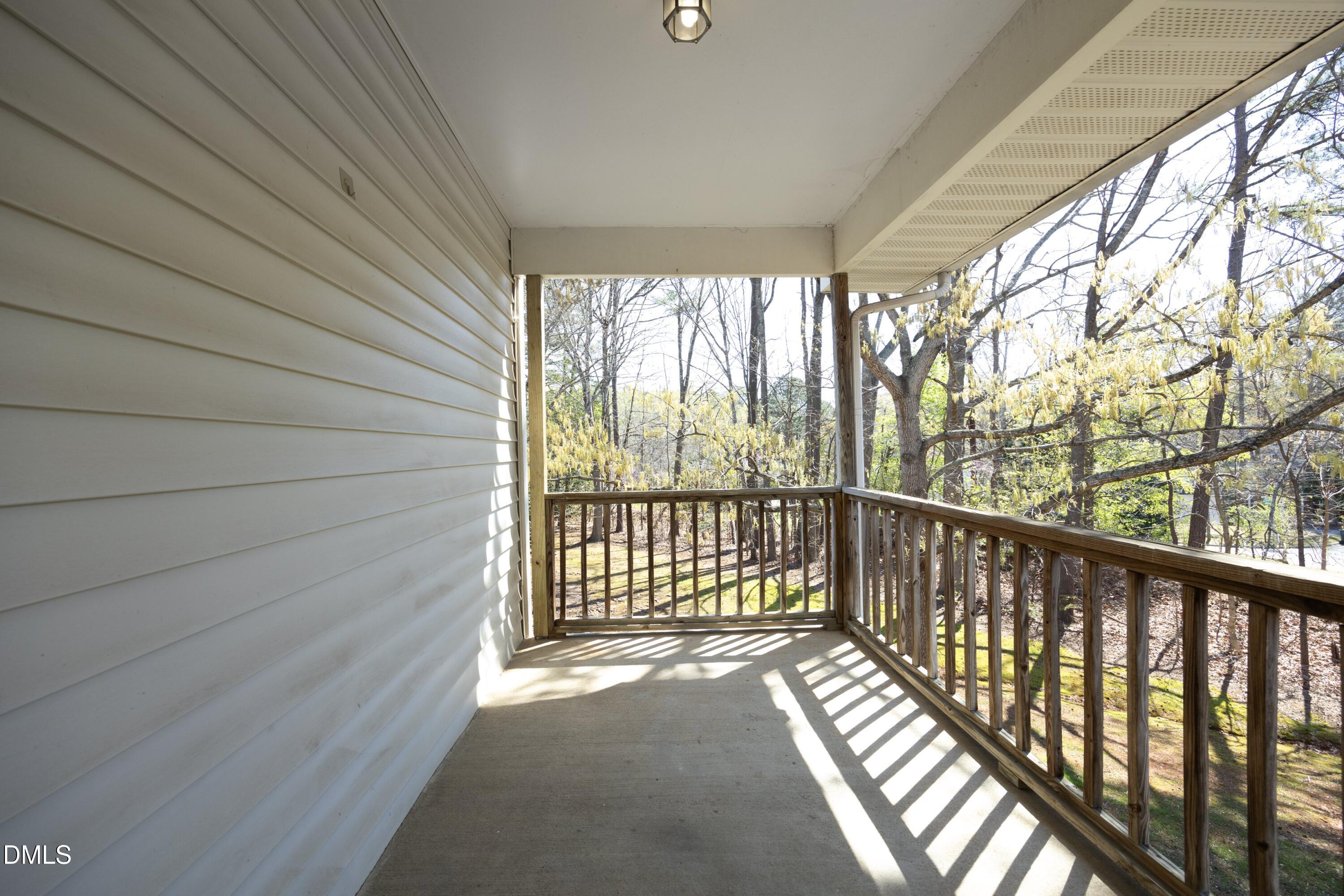 521 Renshaw Court Cary, NC 27518 - Photo 29 of 34 a view of a balcony with wooden floor