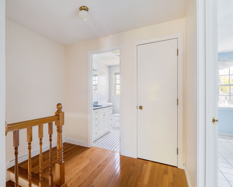 44 Salem Street, Unit C Wakefield, MA 01880 - Photo 14 of 26 a view of a hallway with wooden floor and staircase