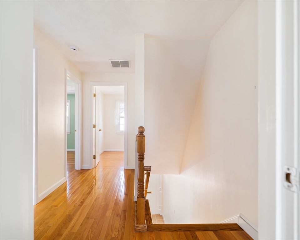44 Salem Street, Unit C Wakefield, MA 01880 - Photo 15 of 26 a view of a room with wooden floor and white walls