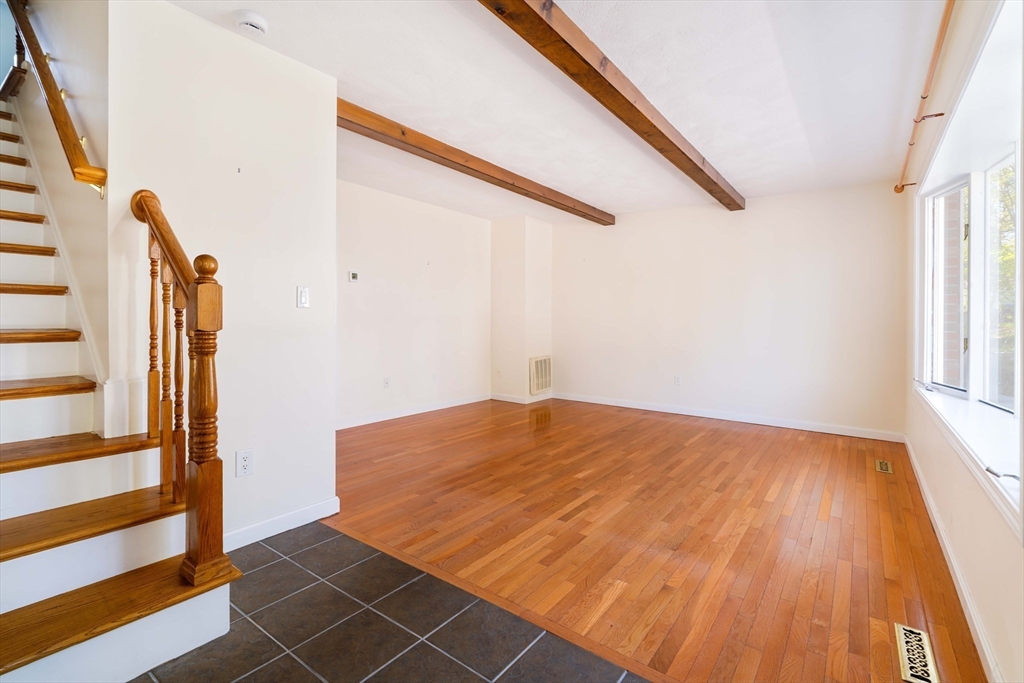 44 Salem Street, Unit C Wakefield, MA 01880 - Photo 2 of 26 a view of a room with wooden floor and stairs