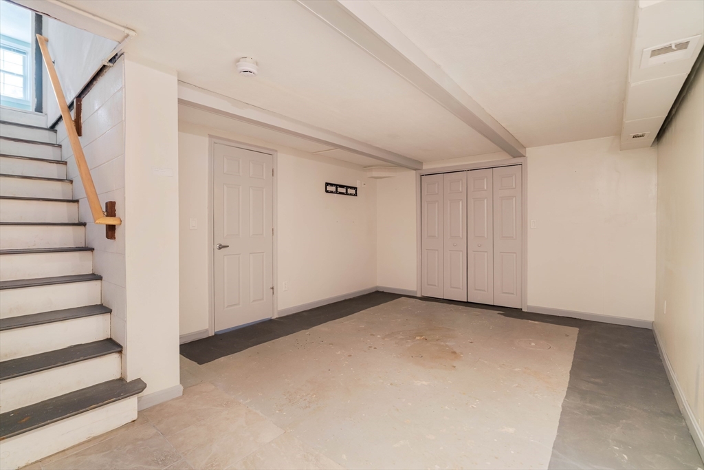 44 Salem Street, Unit C Wakefield, MA 01880 - Photo 21 of 26 a view of an empty room with stairs