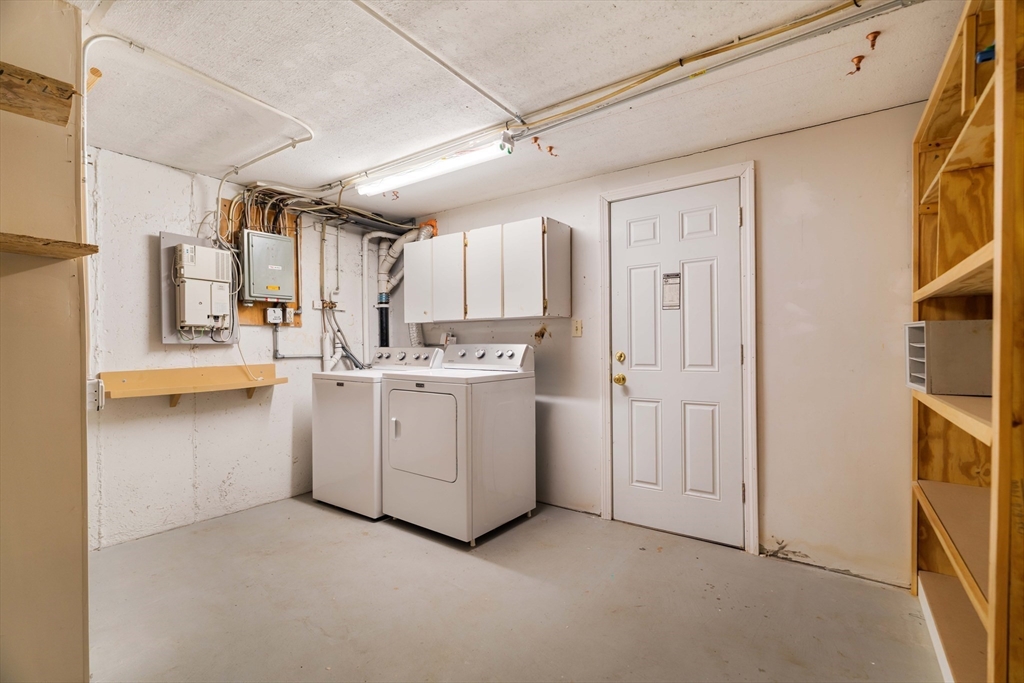 44 Salem Street, Unit C Wakefield, MA 01880 - Photo 23 of 26 a utility room with cabinets washer and dryer