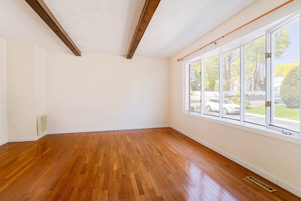 44 Salem Street, Unit C Wakefield, MA 01880 - Photo 3 of 26 a view of a room with wooden floor and a window