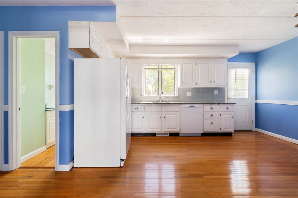 44 Salem Street, Unit C Wakefield, MA 01880 - Photo 8 of 26 a view of a kitchen with wooden floor and a window