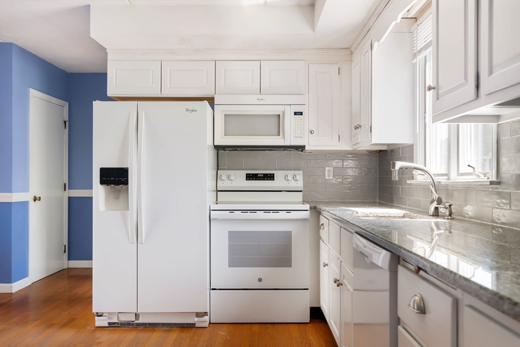 44 Salem Street, Unit C Wakefield, MA 01880 - Photo 10 of 26 a kitchen with cabinets appliances and a sink