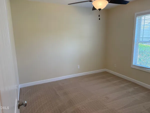 an empty room with a bathroom