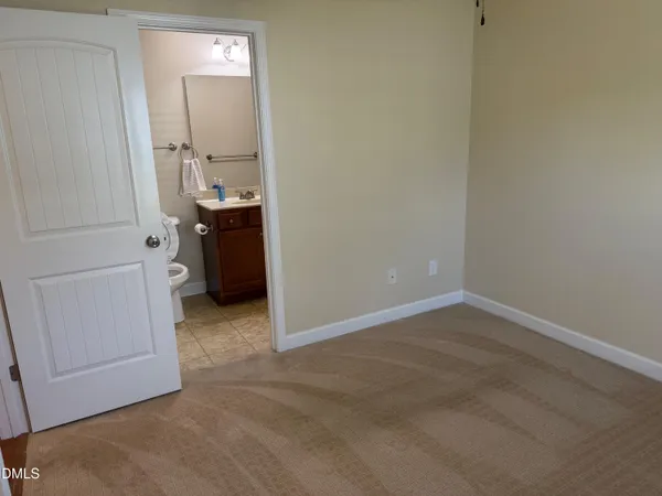 a bathroom with a sink a toilet and vanity