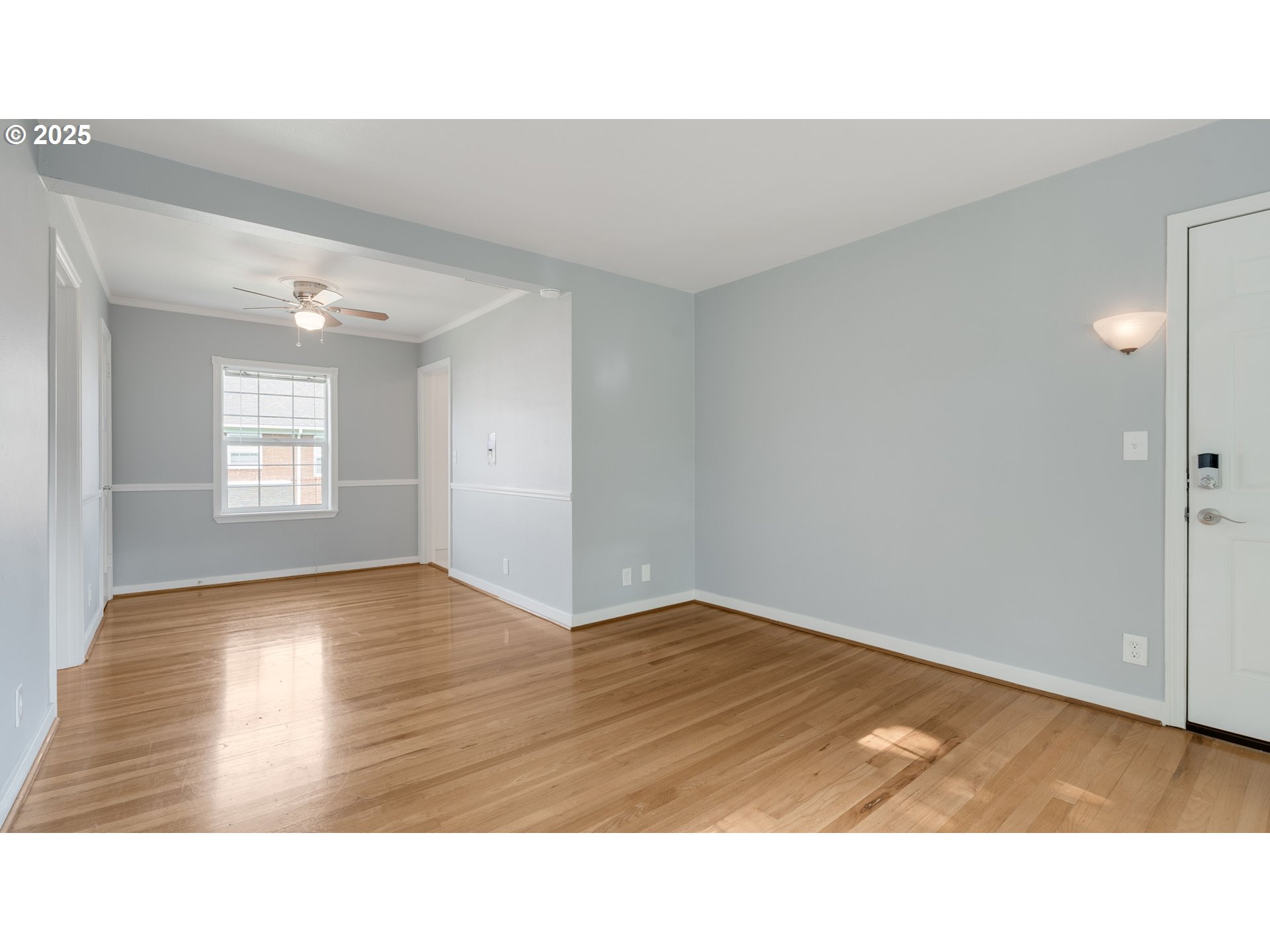 308 East 12th Street, Unit 308B Vancouver, WA 98660 - Photo 8 of 28 a open hall with wooden floor and windows