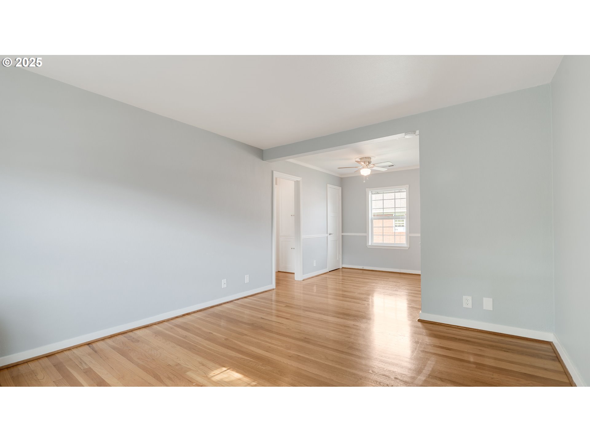 308 East 12th Street, Unit 308B Vancouver, WA 98660 - Photo 9 of 28 a open hall with wooden floor and window