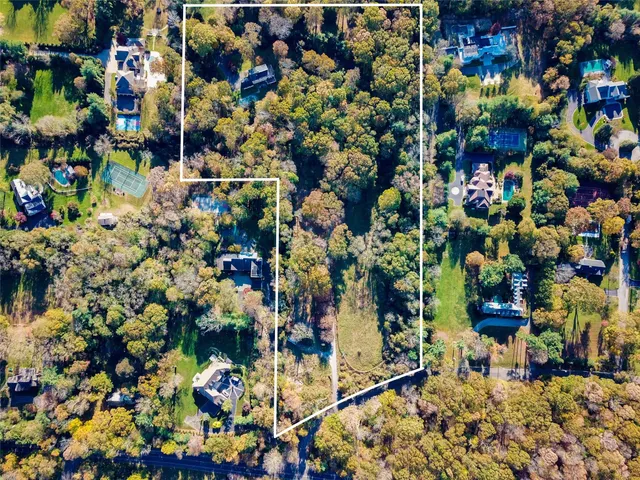 a view of a yard covered with snow