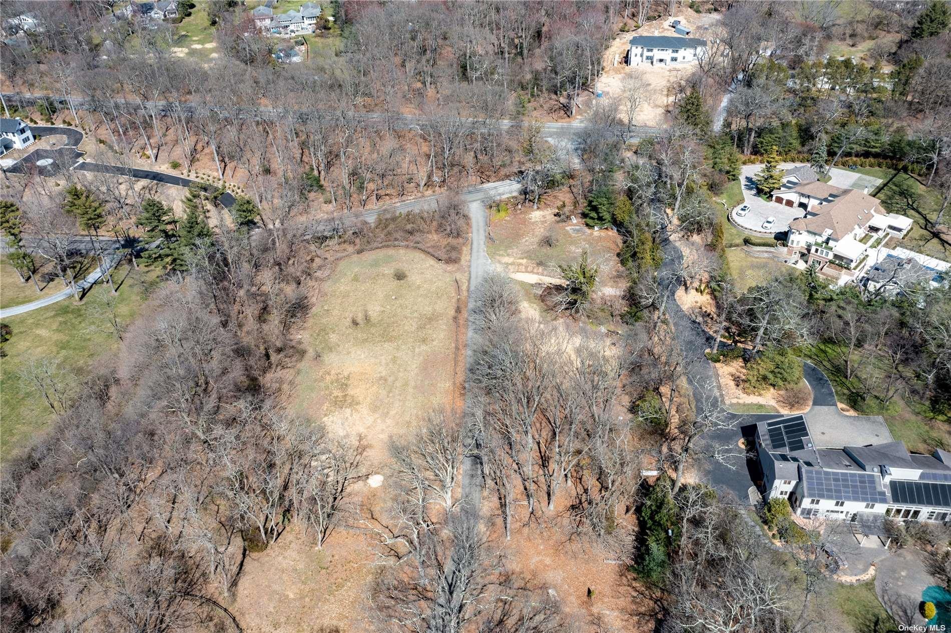 1622 Old Cedar Swamp Road Glen Head, NY 11545 - Photo 5 of 10 a aerial view of residential house with outdoor space