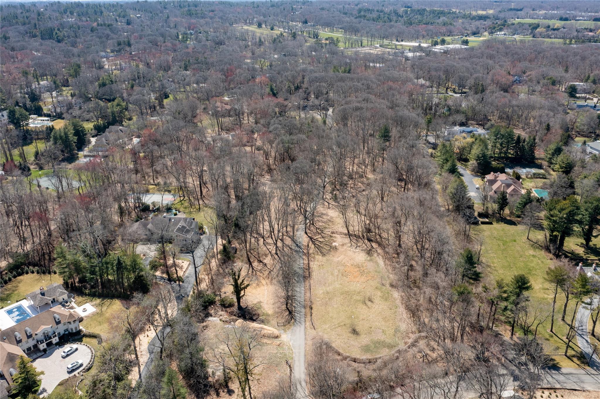 1622 Old Cedar Swamp Road Glen Head, NY 11545 - Photo 8 of 10 a view of a yard covered with snow