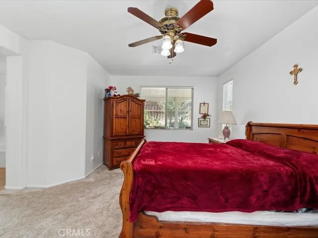 a bed room with furniture and a window
