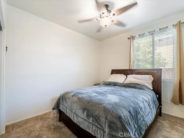 a spacious bathroom with a double vanity sink a mirror and a bathtub